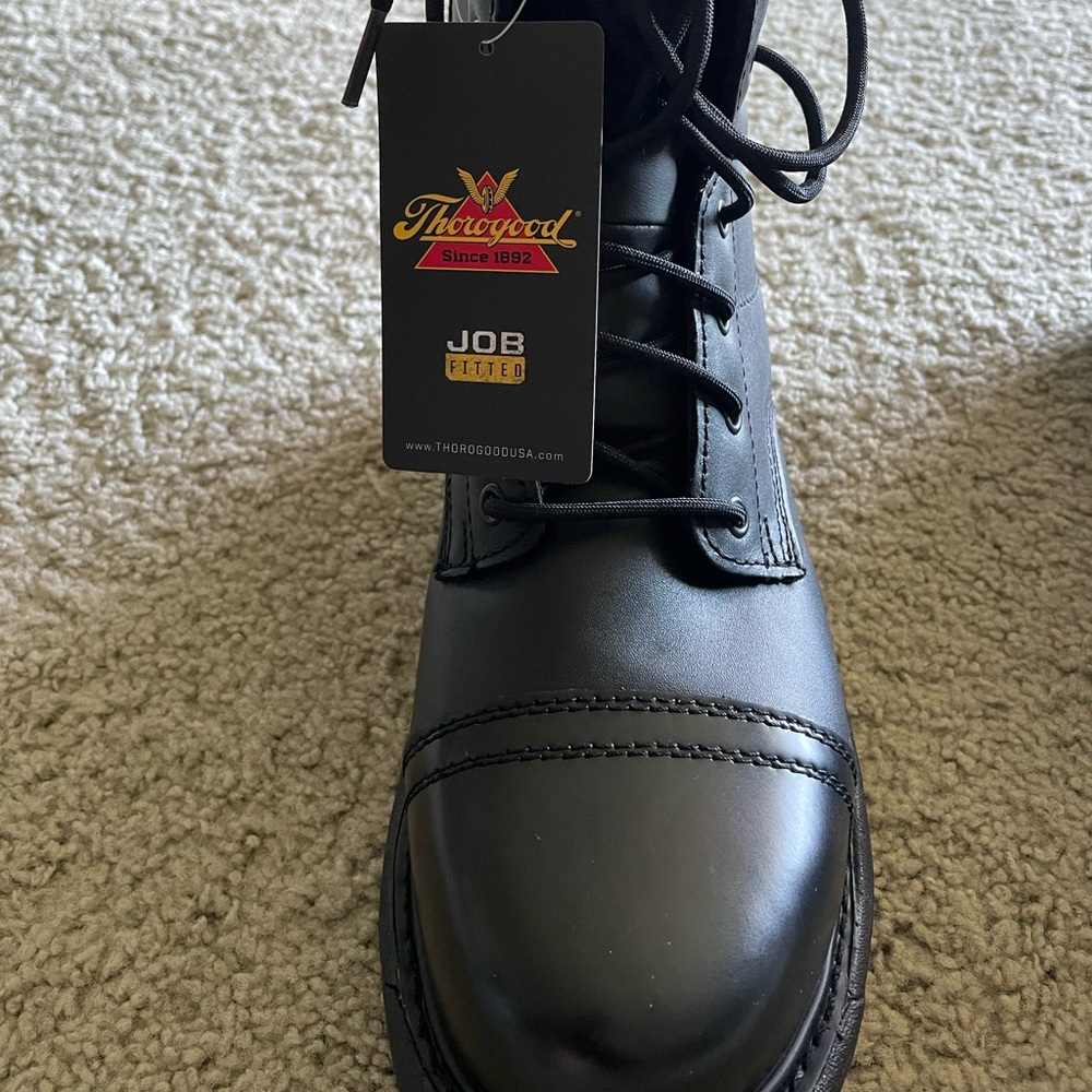 Thorogood, black boots that have never been worn with the tag still on them.